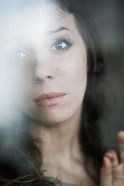 Reflection o woman in the window — Stock Photo, Image