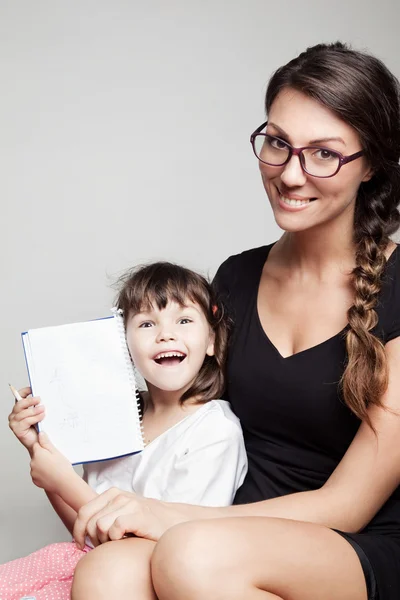 Little girl with her teacher — Stock Photo, Image