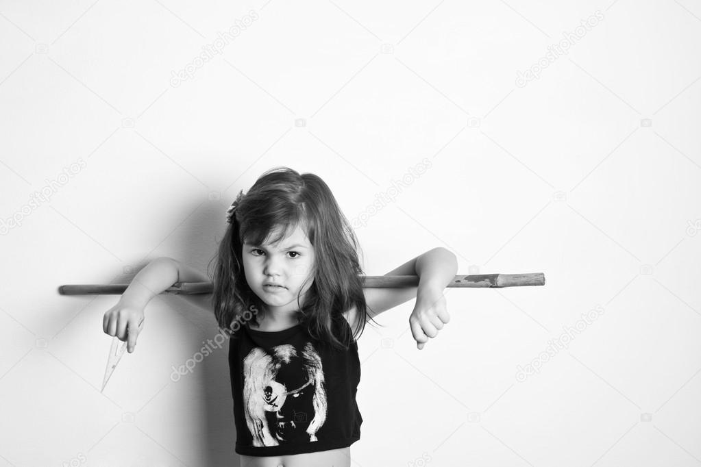 Little girl with stick