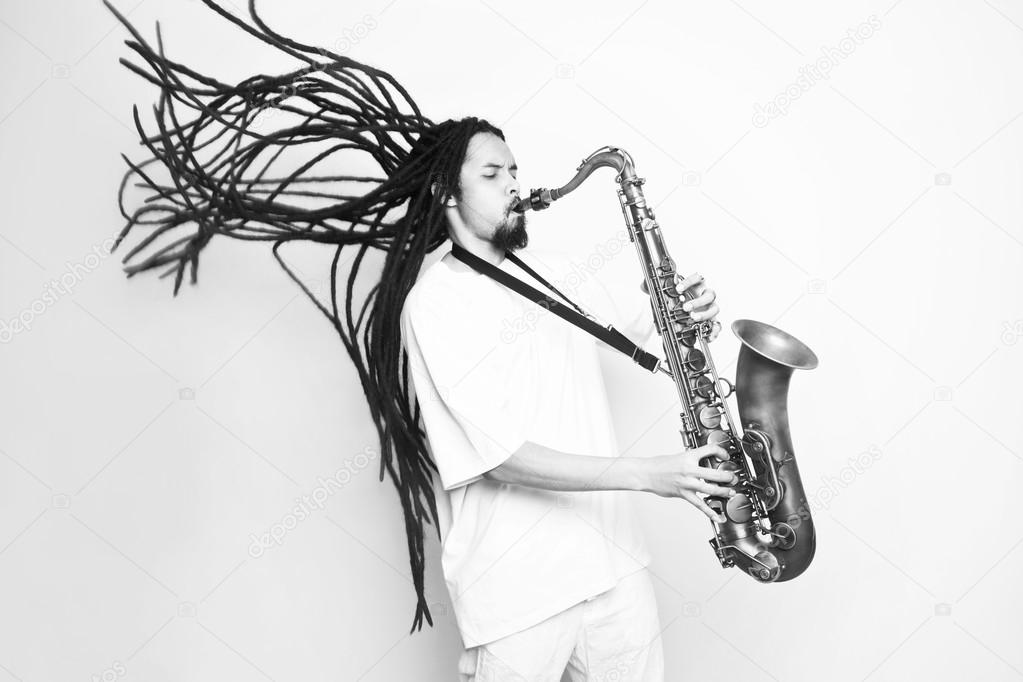 Male saxophonist with dreadlocks