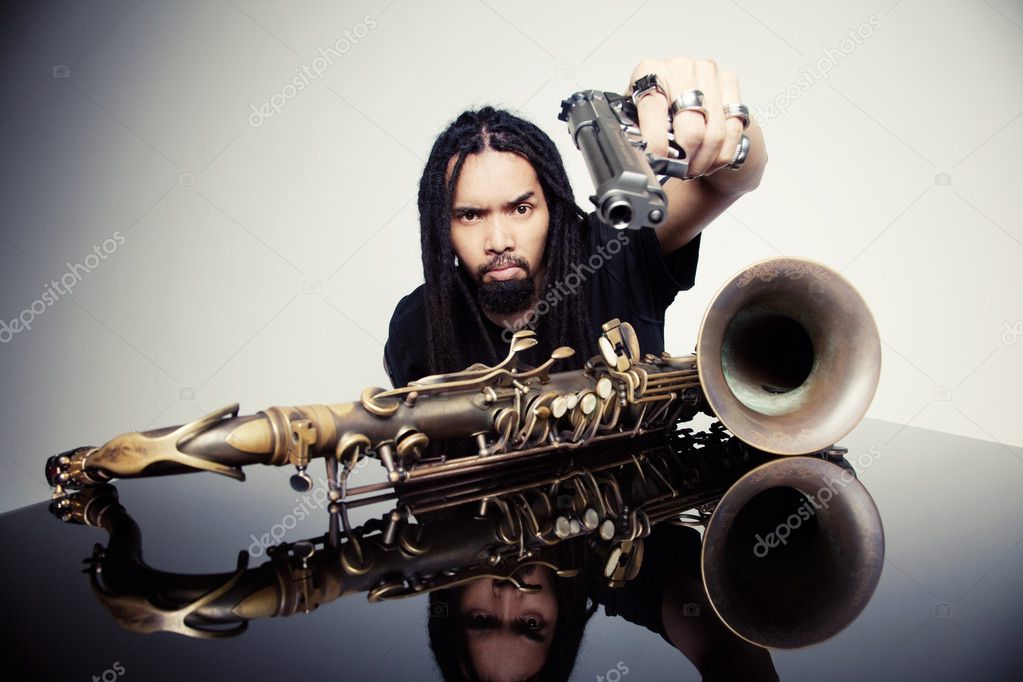 saxophonist with a gun  in hand
