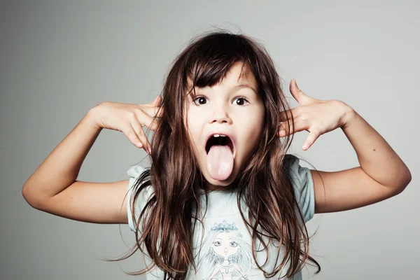 Girl showing tongue — Stock Photo, Image