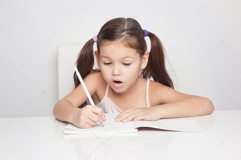 Girl writing in a notebook