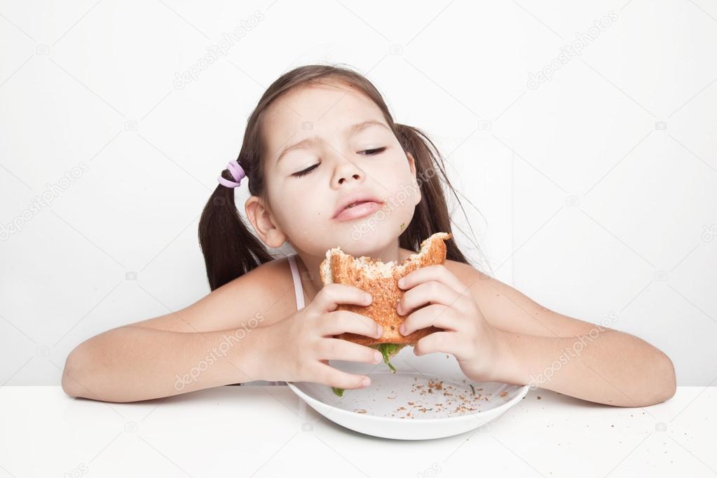 Girl eating a vegan sandwich
