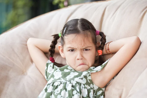 Child resting in a chair — Stock Photo, Image