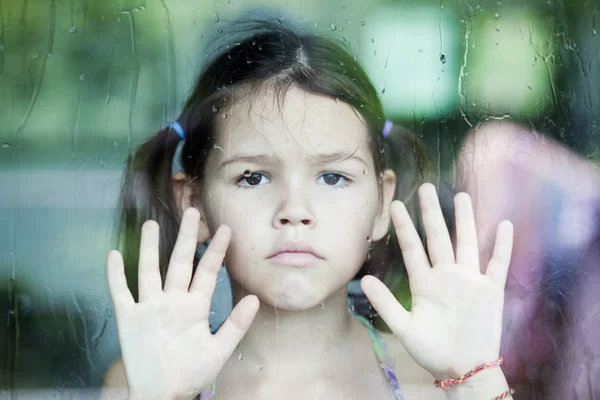 Asian girl is sad at the window — Stock Photo, Image