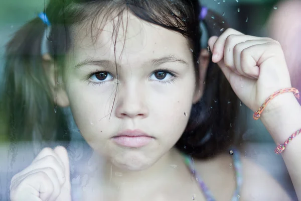 Asian girl is sad at the window — Stock Photo, Image