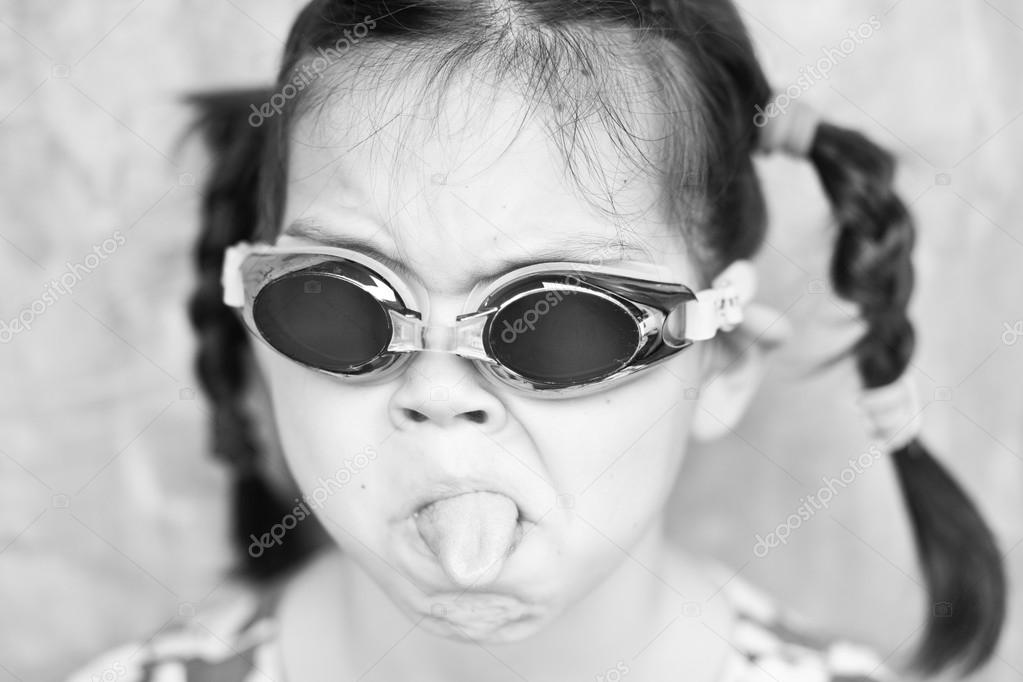 Little Asian Girl in swimming glasses
