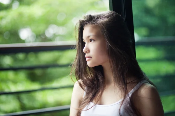 Grl sitting near the window — Stock Photo, Image