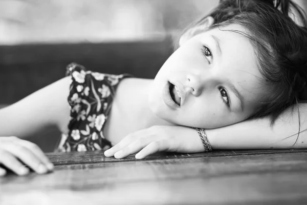 Tired girl at the table — Stock Photo, Image