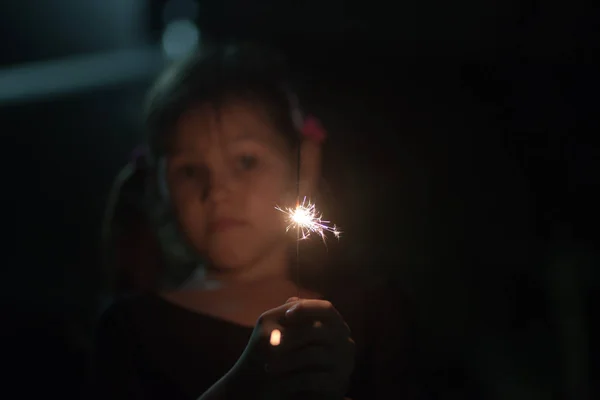 Little girl with sparkler — Stock Photo, Image
