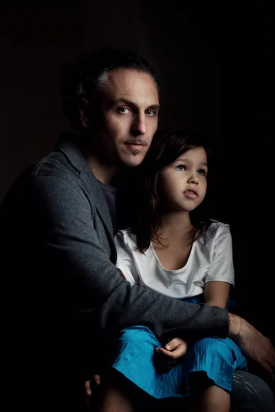 Father holding in embrace tired daughter — Stock Photo, Image