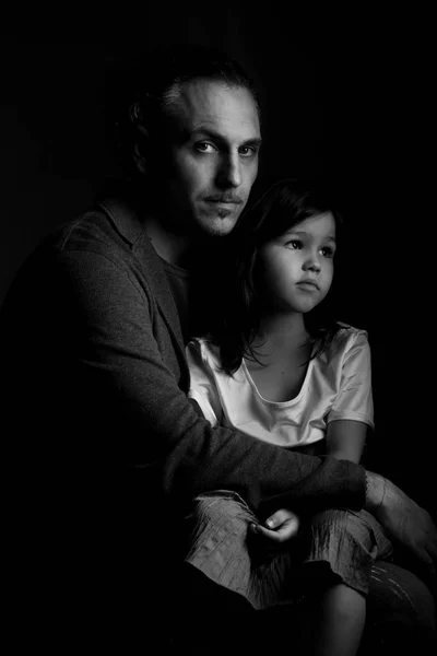 Father holding in embrace tired daughter — Stock Photo, Image