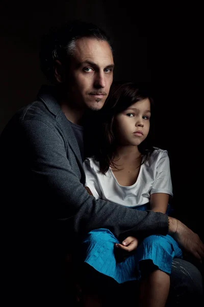 Father holding in embrace tired daughter — Stock Photo, Image