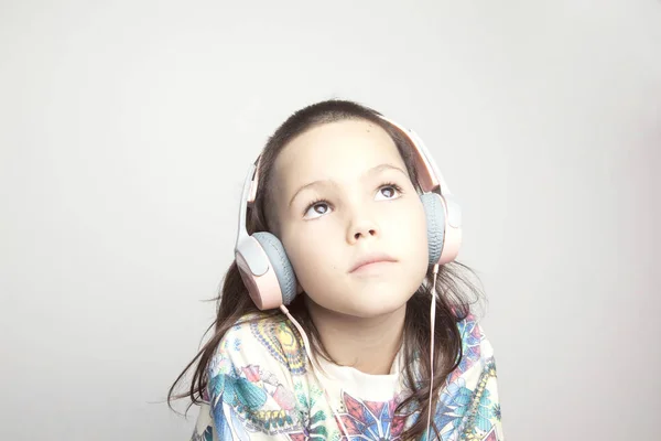 Girl with modern haircut in headphones