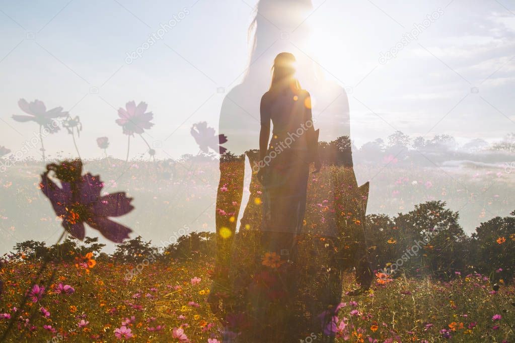 Female silhouette in field of flowers, double exposure