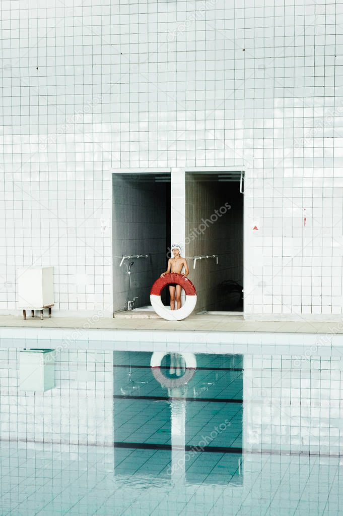  boy with flotation ring 