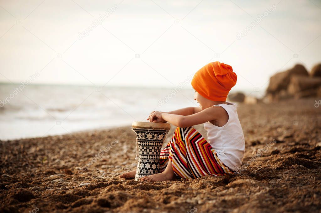 boy sitting with drum