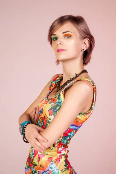 Young girl with a partly colored hair in a colorful dress — Stock Photo, Image