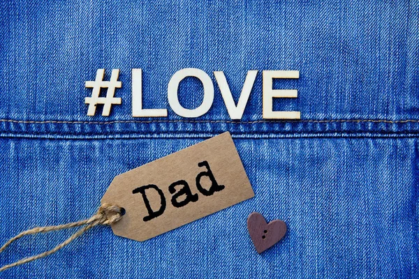 #Tata miłości na niebieski denim — Zdjęcie stockowe