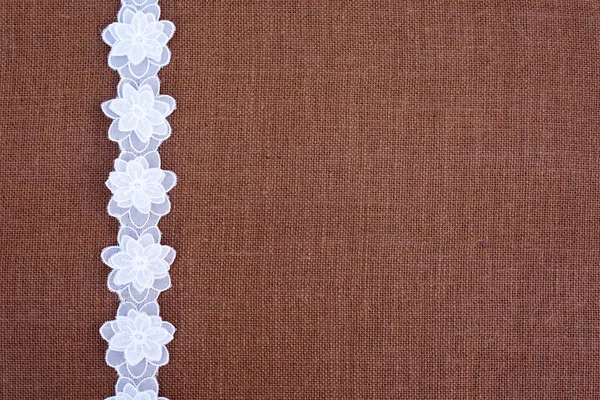 Burlap background - white  lace — Stock Photo, Image