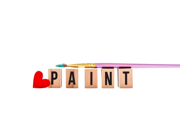 Love Paint - блоки та пензлик на білому тлі — стокове фото