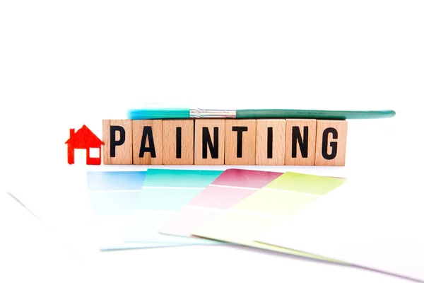 Peinture de maison - blocs, pinceau et nuances sur fond blanc — Photo