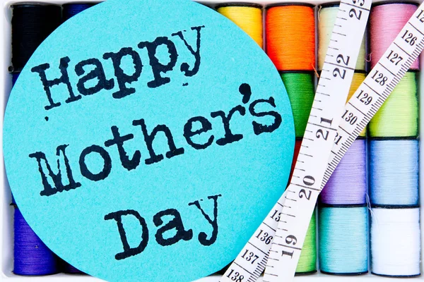Sewing - Thread - coloful Cotton Reels with Happy Mother's Day and tape measure — Stock Photo, Image