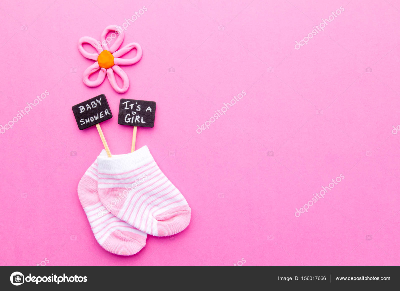 baby girl pink and white socks on pink background with baby shower baby announcement background