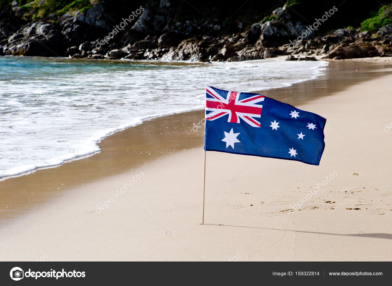 Australian Flag waving in the wind on beach Photo by ©Creativefire 159322814