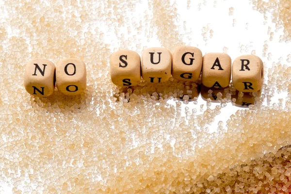 No Sugar - in wooden block letters with granules of sugar on mir