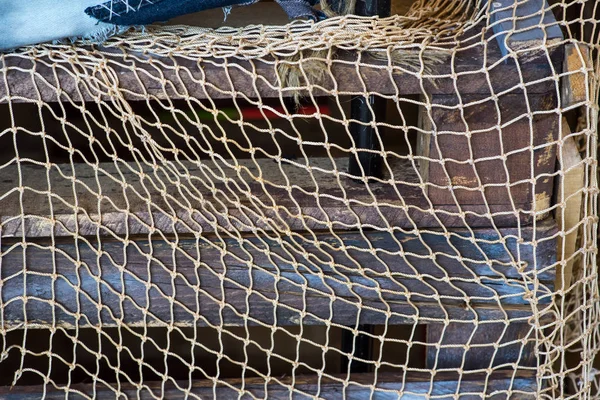 Fishing nets on blue, grey wooden background — Stock Photo, Image