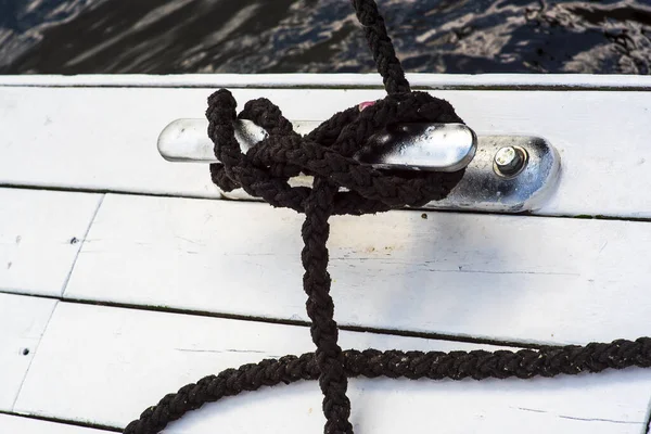 Marina bollard bitt at jetty for boats, ships and yachts mooring knecht cross — Stock Photo, Image