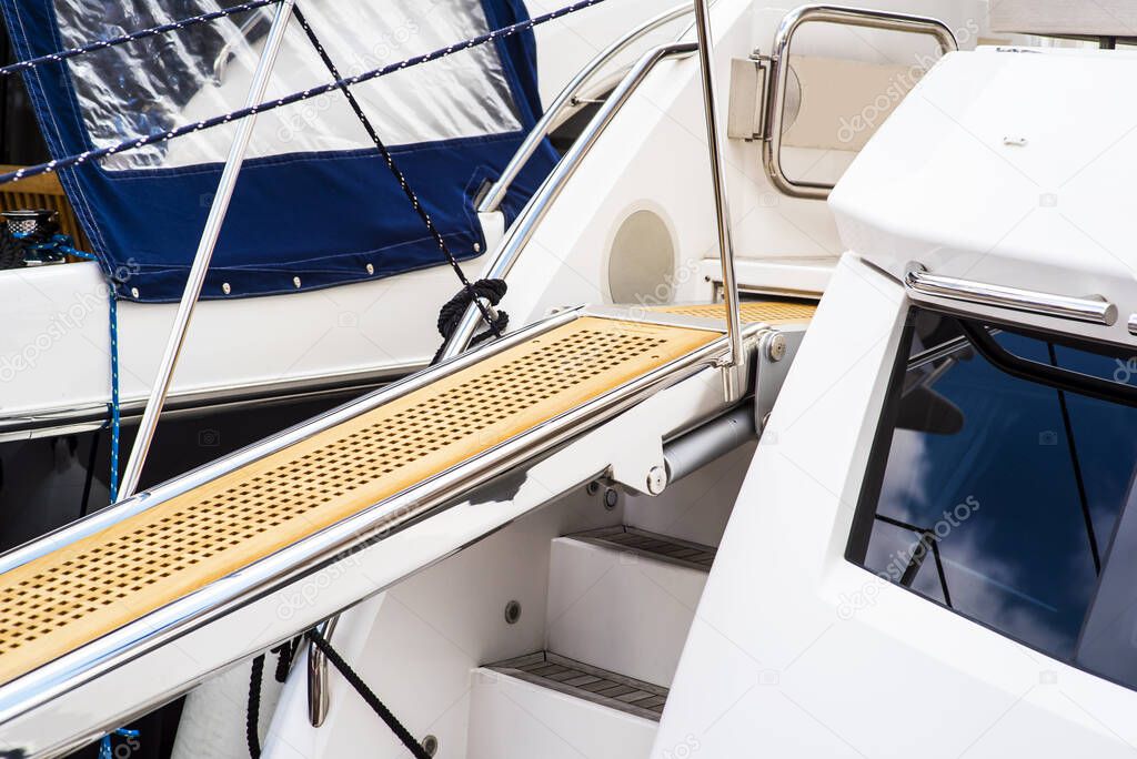 Yacht boarding ladder with rotating platform.
