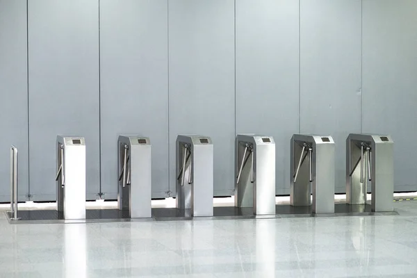 No passage, concept. Turnstiles are closed, chrome turnstiles with a red prohibiting signal. — Stock Photo, Image