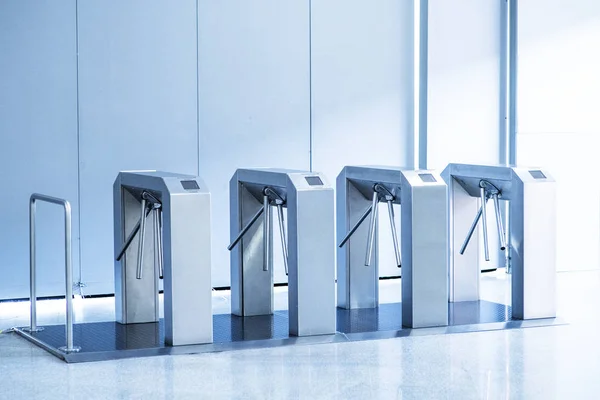 No passage, concept. Turnstiles are closed, chrome turnstiles with a red prohibiting signal. — Stock Photo, Image