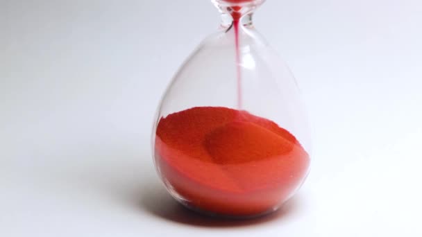 Hourglass with red sand macro detail — Stock Video