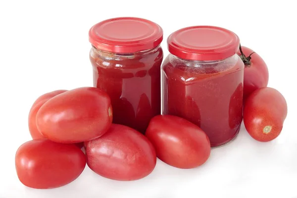 Tomatoes and pulp as preserve — Stock Photo, Image