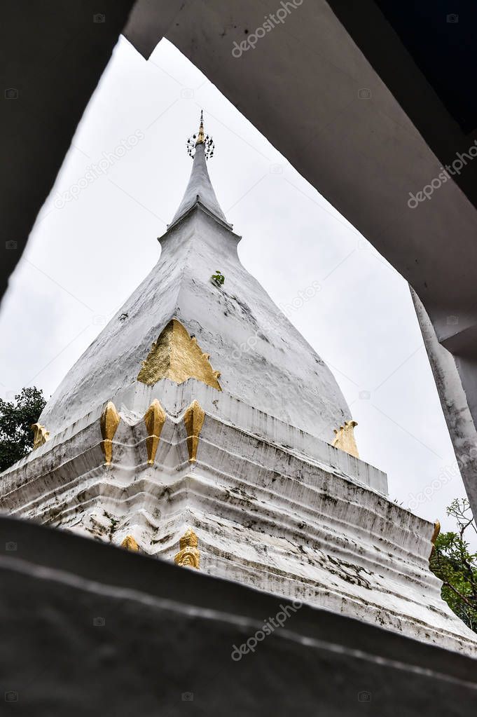 close-up of white pagoda in window frame
