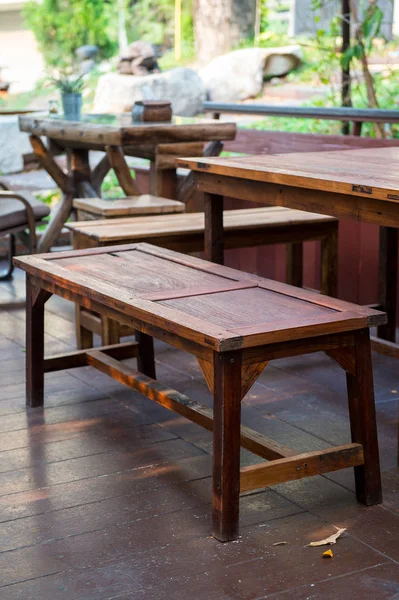 Closeup of old wood stool and table — Stock Photo, Image