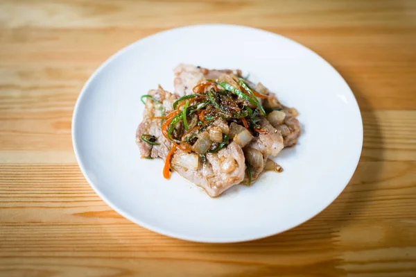 Closeup of pork fried on white dish — Stock Photo, Image