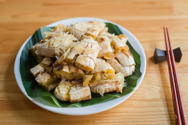 Dessert fruit of banana grilled on white dish closeup — Stock Photo, Image