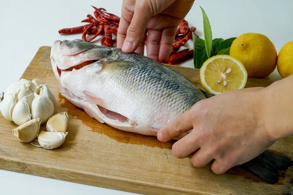 Preparing for Seabass steam with lemon, garlic and chili - Thai food, isolated on white background — Stock Photo, Image