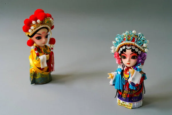 Traditional married Chinese dolls isolate on gray background - focusing on bride