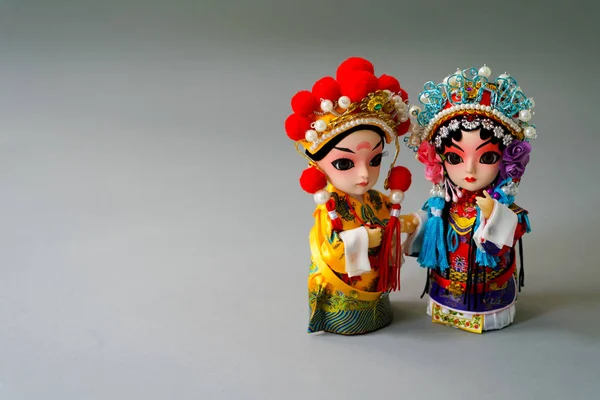 Traditional married Chinese dolls isolate on gray background