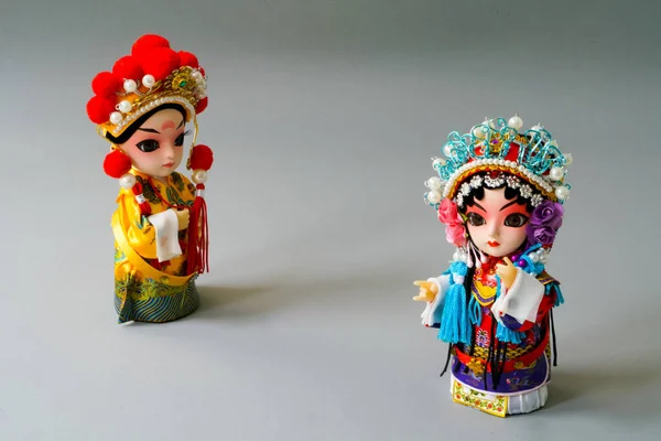 Traditional married Chinese dolls isolate on gray background