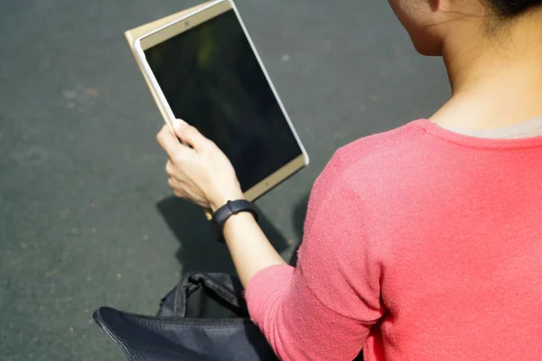 Young student women looking at the tablet computer — Stock Photo, Image