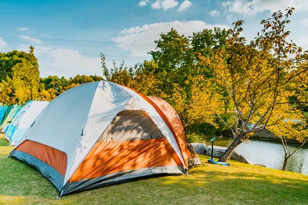 camping and tent riverside on the sunny day, relax and lifestyle