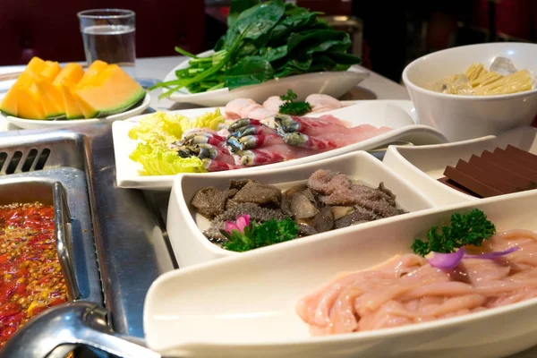 Fish, meat intestine duck blood and others with the shabu pot in Chinese style — Stock Photo, Image