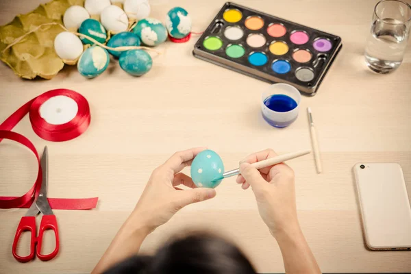 Happy easter, women is painting the easter eggs for easter day festival holiday, easter concept backgrounds with copy space